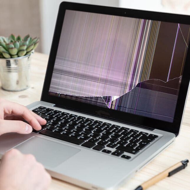 AdobeStock_315562354-1 Laptop with broken screen