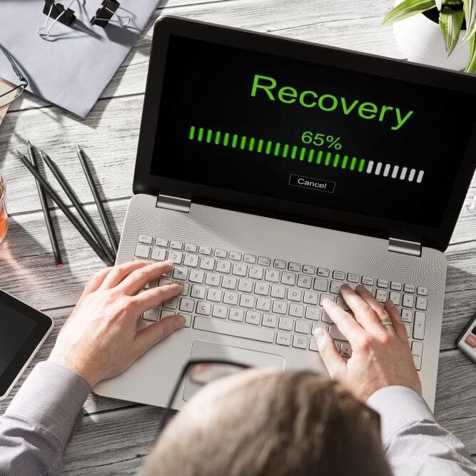 DataRecoveryandLossCaliComp A man working to recover his data after his computer crashed.